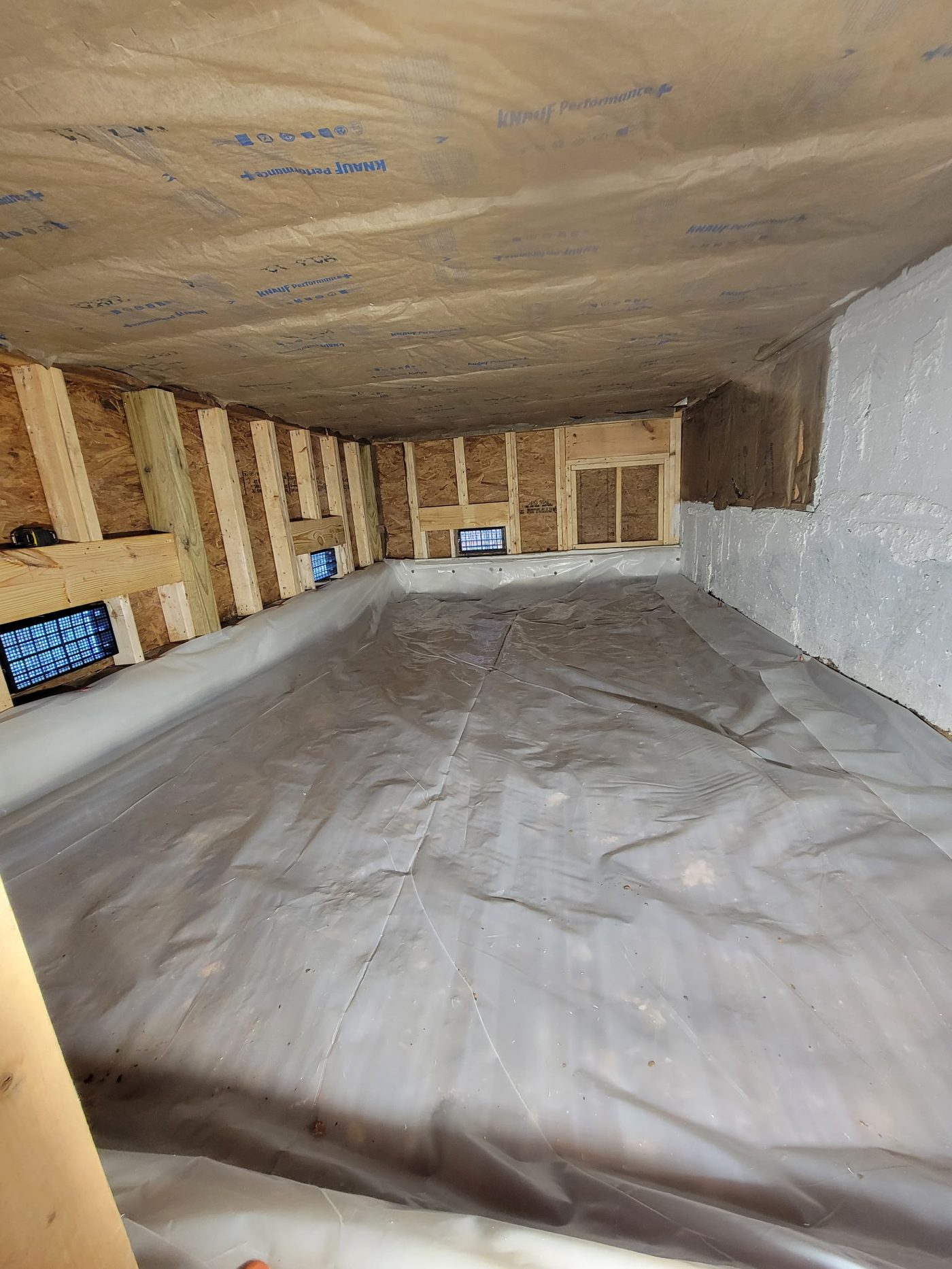Clean crawl space with full vapor barrier encapsulation installed