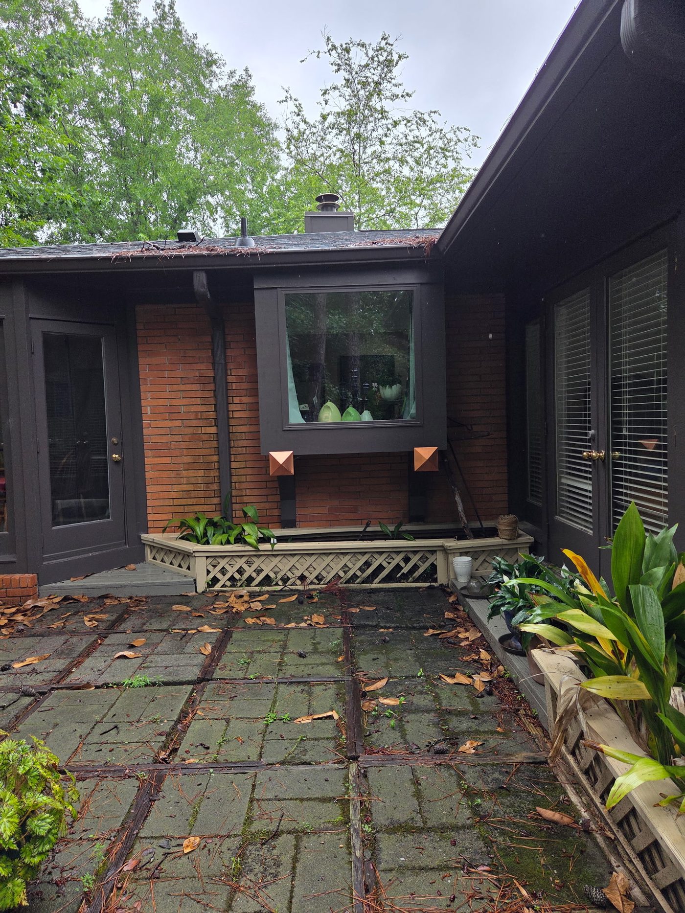 House exterior after painting with dark trim and copper accents