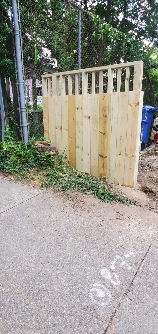 New cedar picket fence freshly installed