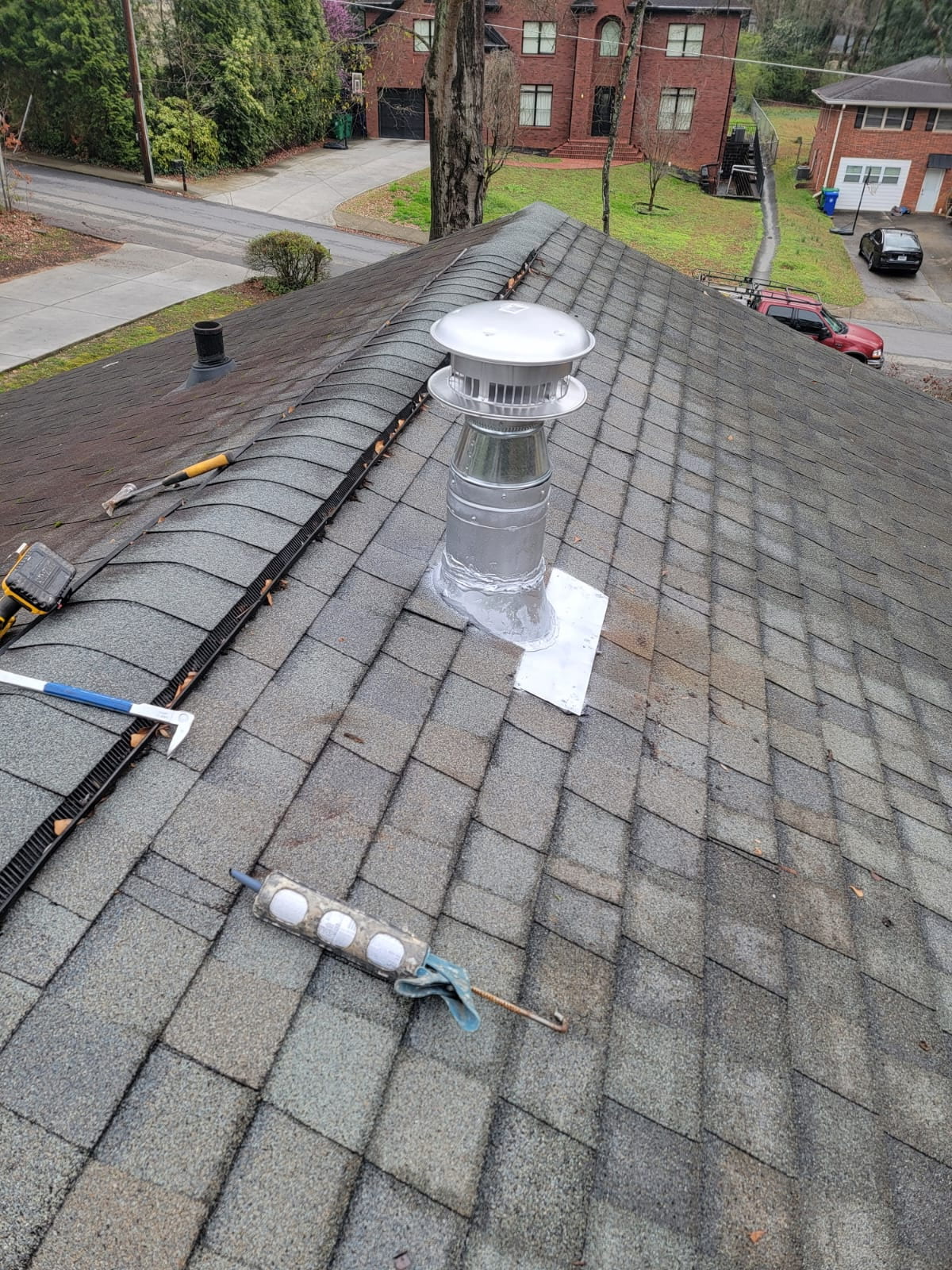 New roof vent installed on shingle roof